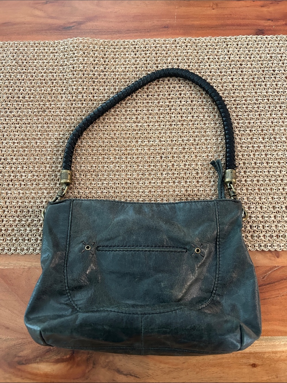 The Sak Black Indio Leather Shoulder Bag with braided strap